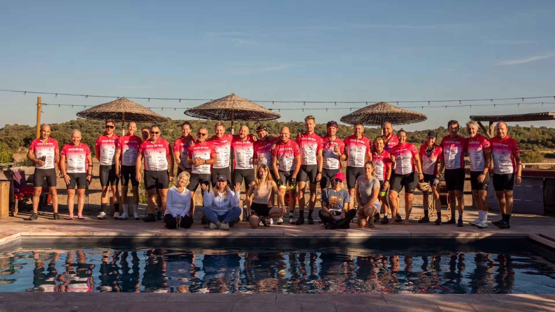 Cancer My Arse riders gathered on a sunny Mediterranean terrace